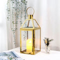 Vintage gold stainless steel decorative candle lantern with glass panes and top hanging ring.