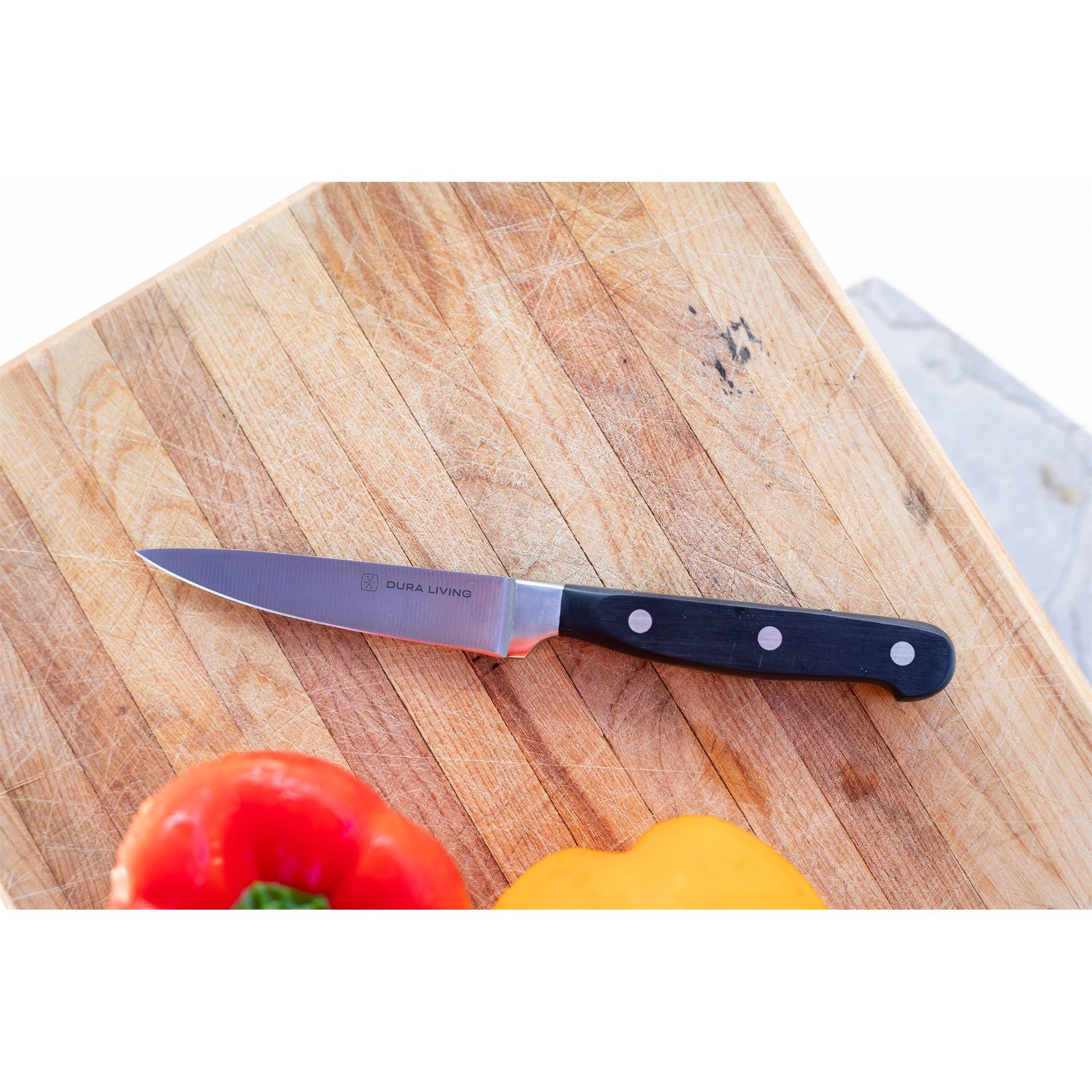Superior 3.5 inch paring knife with black ergonomic handle and high-carbon German steel blade — view 4