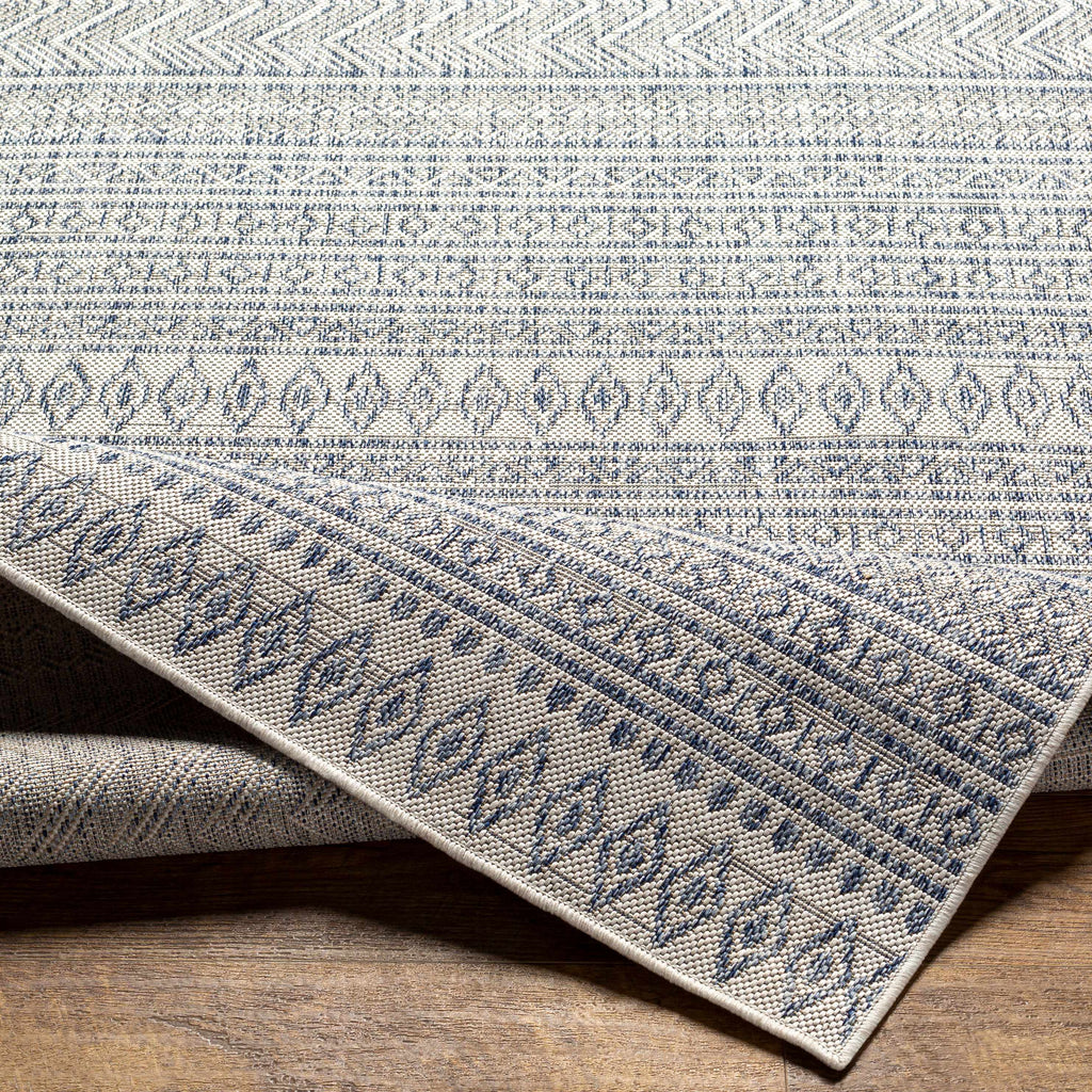 Madras navy blue and gray bohemian performance outdoor area rug in a low profile rectangular shape — view 3