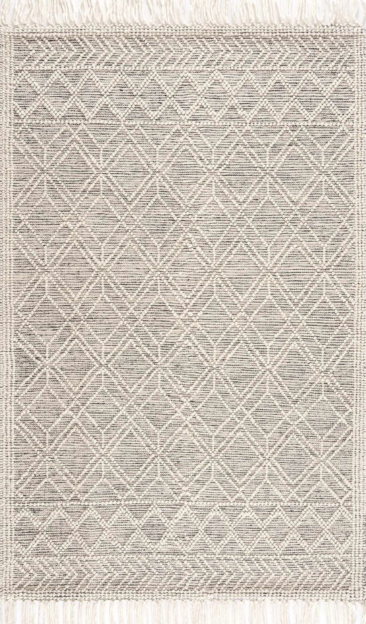 Ivory and black handwoven Ramsbury wool area rug with geometric pattern and corner tassels