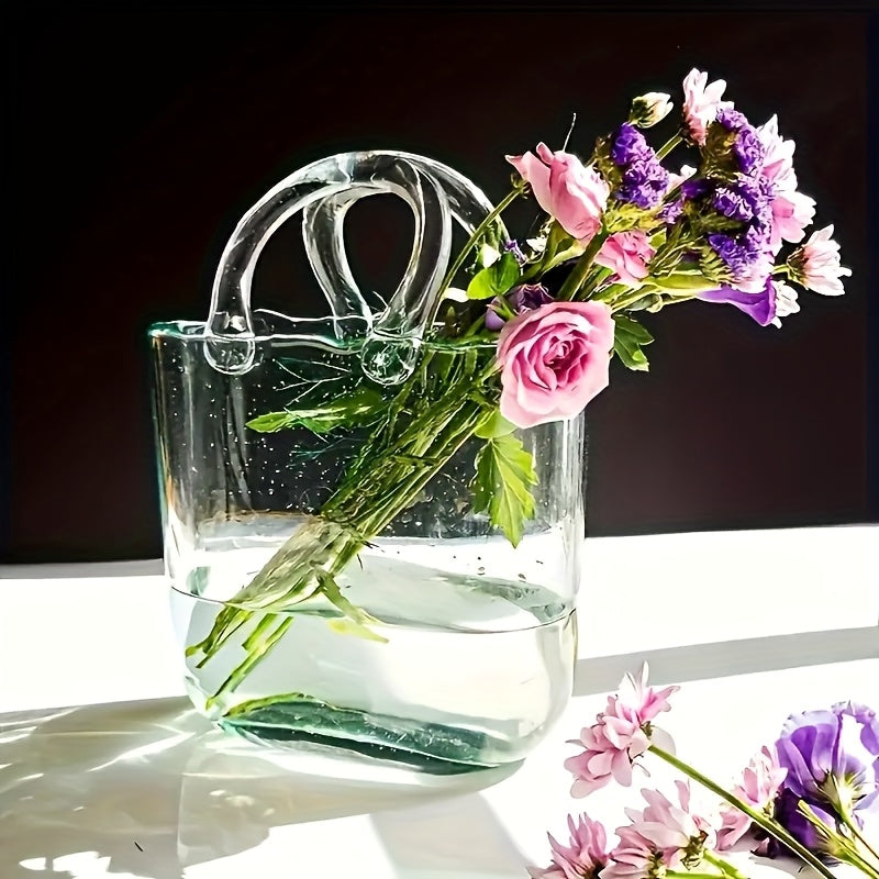 Clear transparent glass handbag vase doubling as a desktop fish tank and decorative hydroponic plant container — view 2