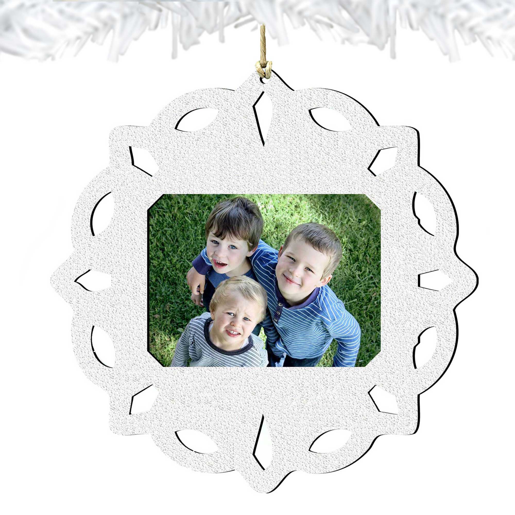 Wooden handcrafted snowflake Christmas tree ornament holding a small rectangular family photograph inside — view 4
