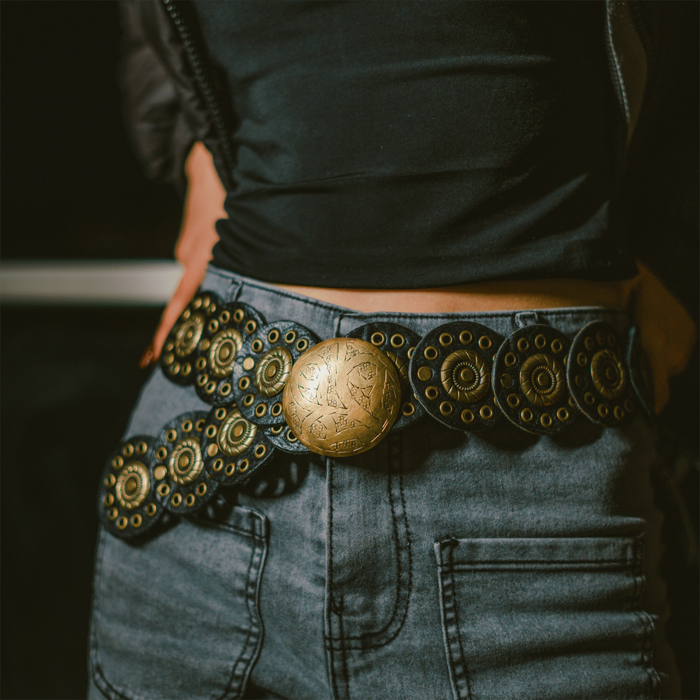 Rona handcrafted full-grain leather belt featuring rounded elements and an aged copper buckle