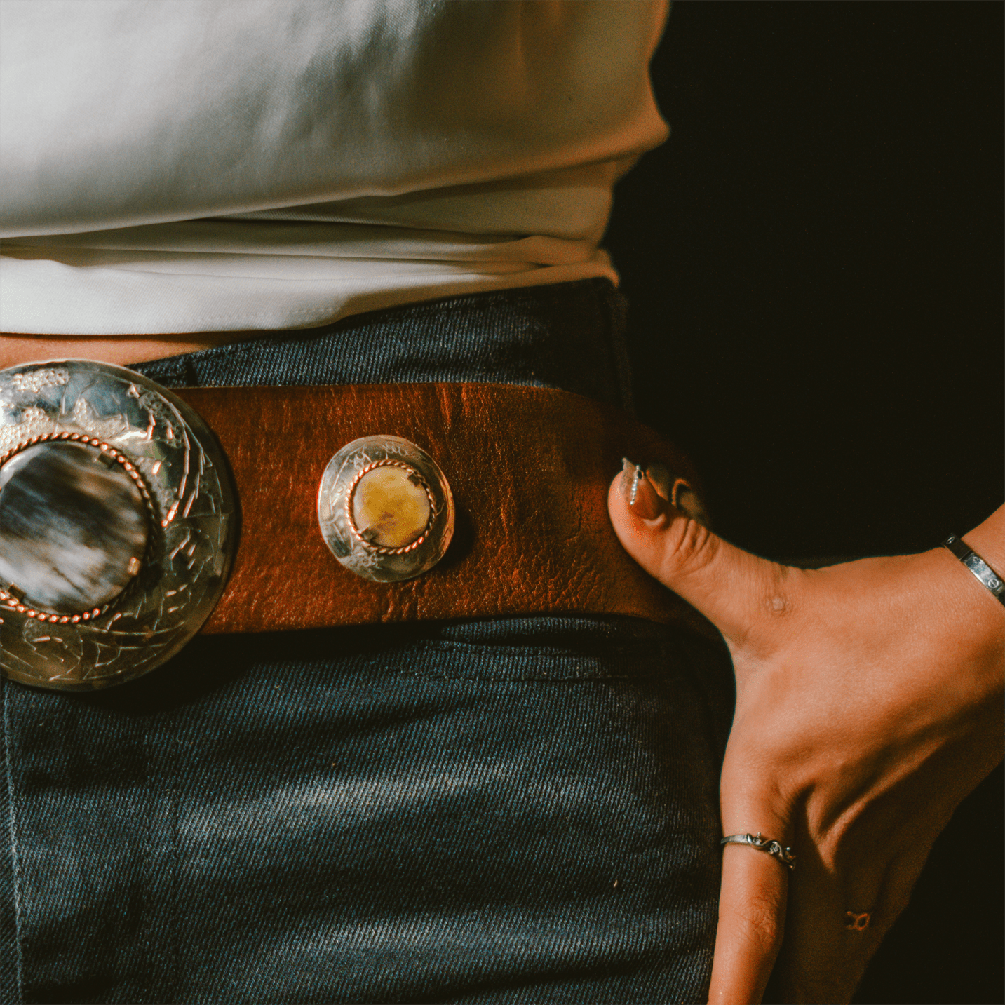 Genuine Moroccan leather belt featuring a patinated copper and bone buckle on a plain background — view 4