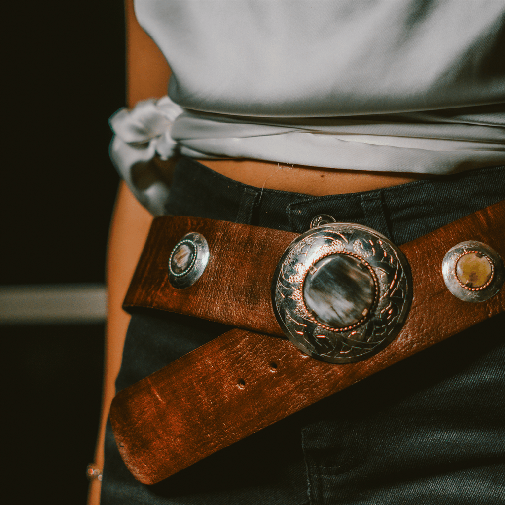 Genuine Moroccan leather belt featuring a patinated copper and bone buckle on a plain background — view 5