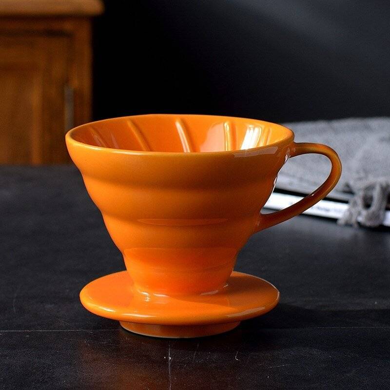 Pour over coffee dripper featuring a reusable stainless steel mesh filter and angled cone design — view 5