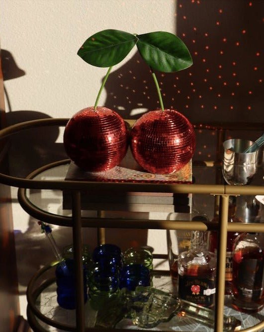 Two connected cherry disco balls covered in sparkling silver glass mosaic tiles — view 2