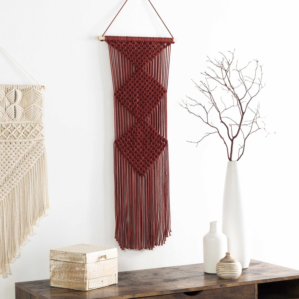Burgundy rust macrame wall hanging decor made of woven cotton suspended on a natural wood rod — view 2