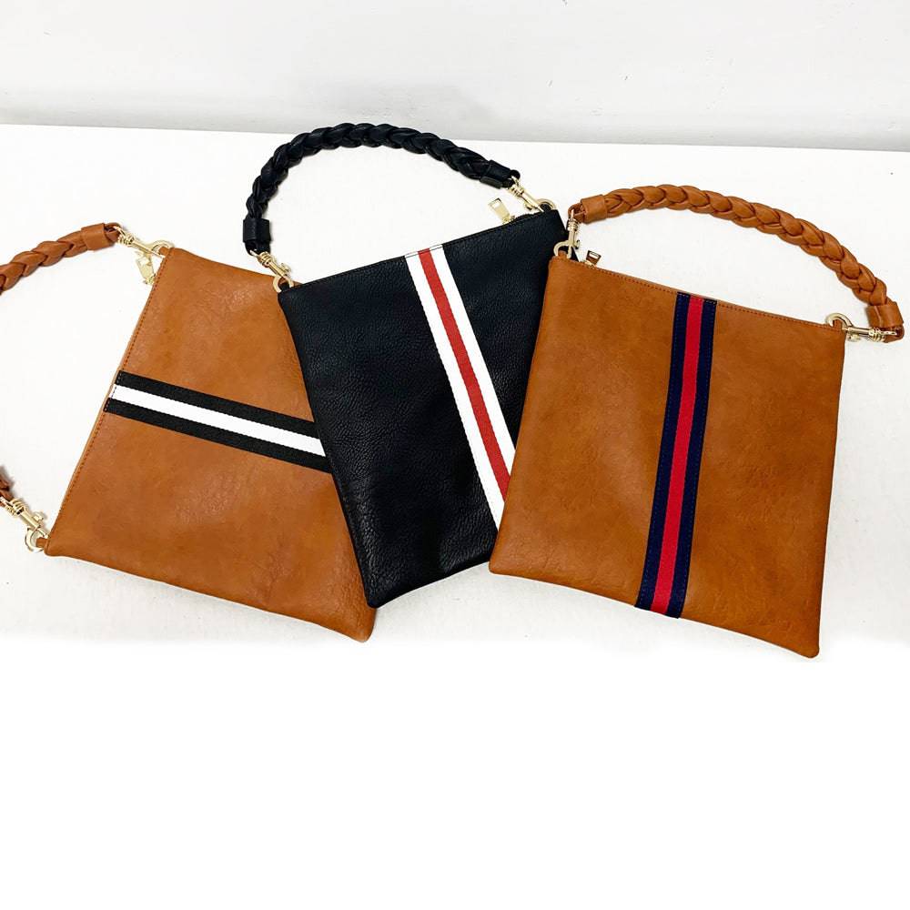 Vegan leather fold over clutch bag with accent stripe and removable braided woven shoulder strap — view 4
