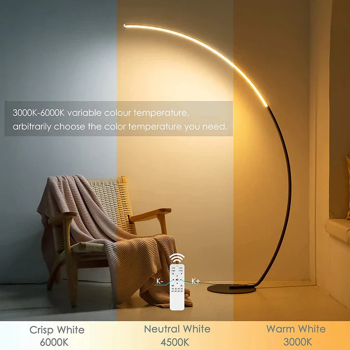 Modern RGBW curved floor lamp in black metal emitting colorful ambient lighting in a room — view 2