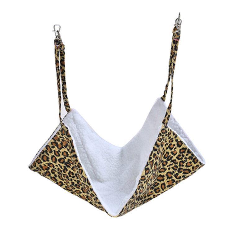 Leopard print double-sided plush and canvas cat hammock hanging securely under a wooden chair — view 4