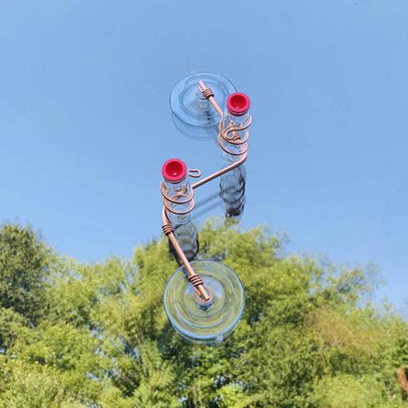 Handmade copper wire hummingbird feeder with clear nectar bottles and suction cups — view 2