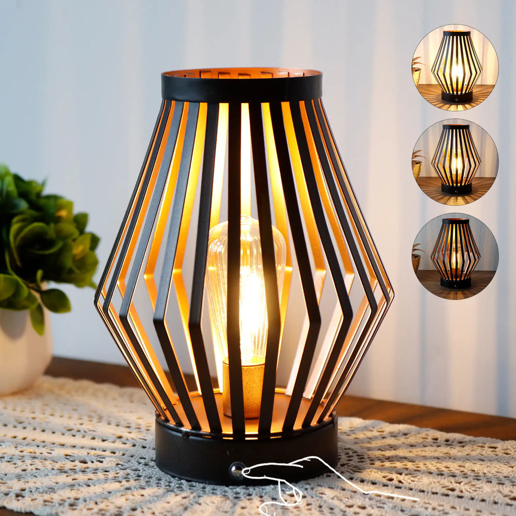Set of two vintage bronze metal cage table lamps with warm glowing bulbs — view 3