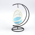 Cozy Haven plastic bird swing with sturdy iron frame base in a neutral color
