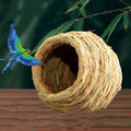Hand-woven natural straw bird nest providing a cozy and warm retreat for small pets