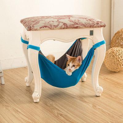 CozyCat hanging cat hammock bed in breathable cotton attached to wooden chair legs