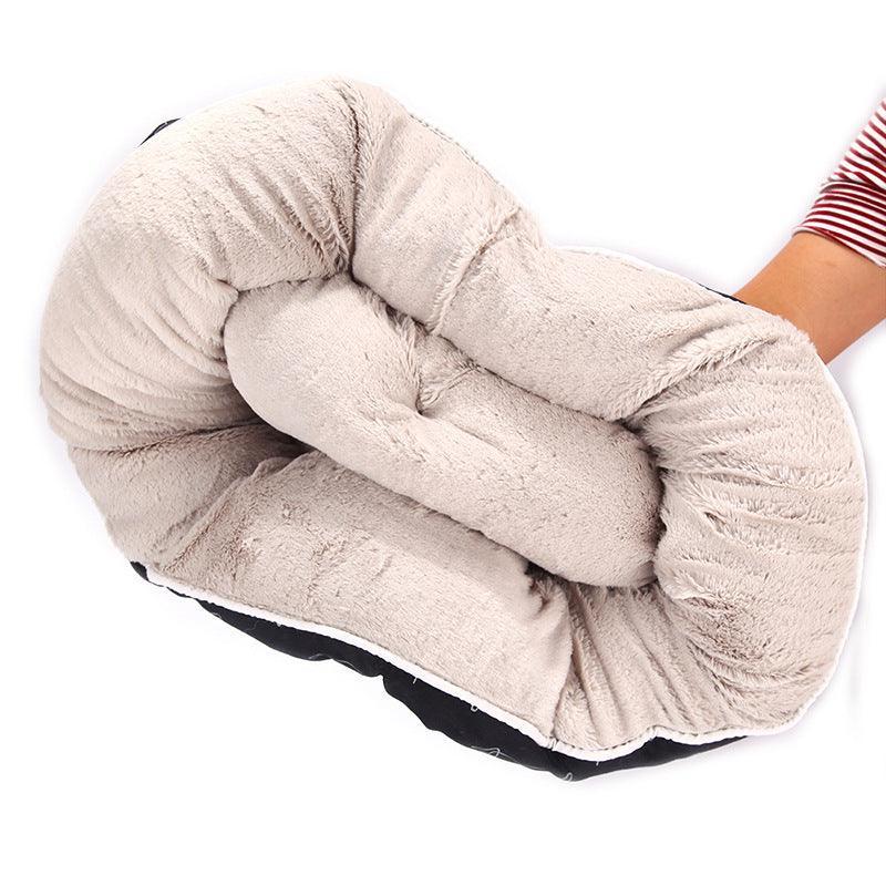 Sleek black CozyPaws round dog bed with washable cloth cover in a modern home setting — view 5