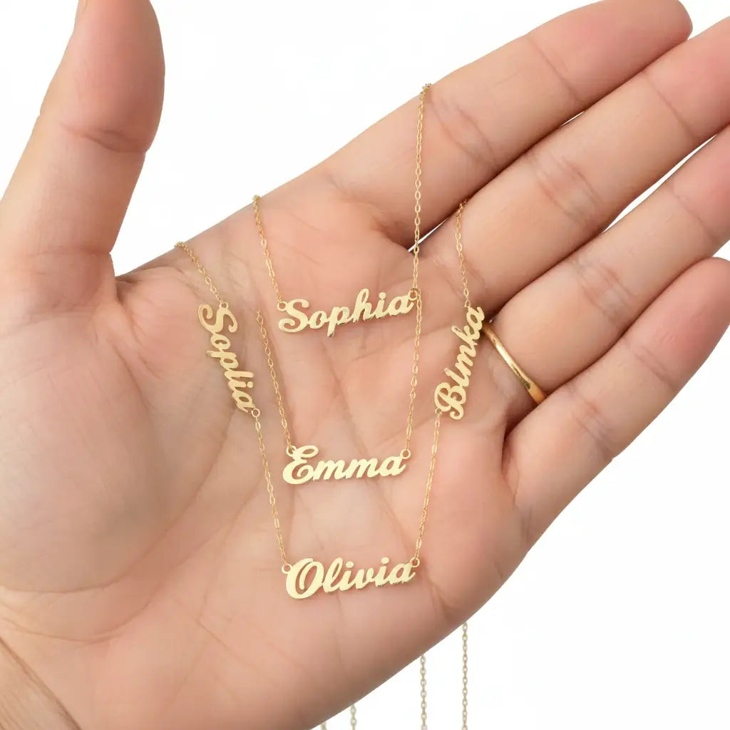 Personalized gold nameplate necklace featuring three custom name charms on an adjustable chain. — view 4