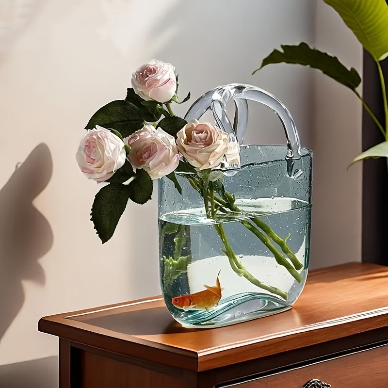 Clear transparent glass handbag vase doubling as a desktop fish tank and decorative hydroponic plant container — view 4
