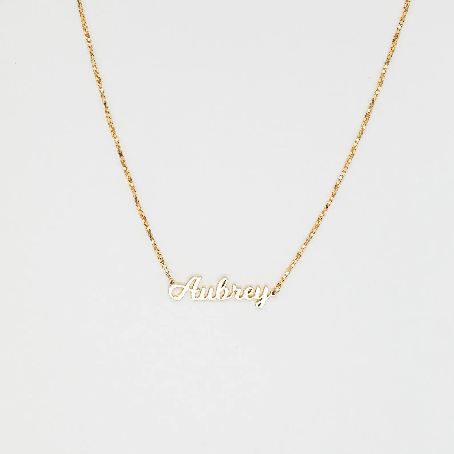 Personalized name necklace in elegant script font with a delicate gold chain and clasp. — view 4
