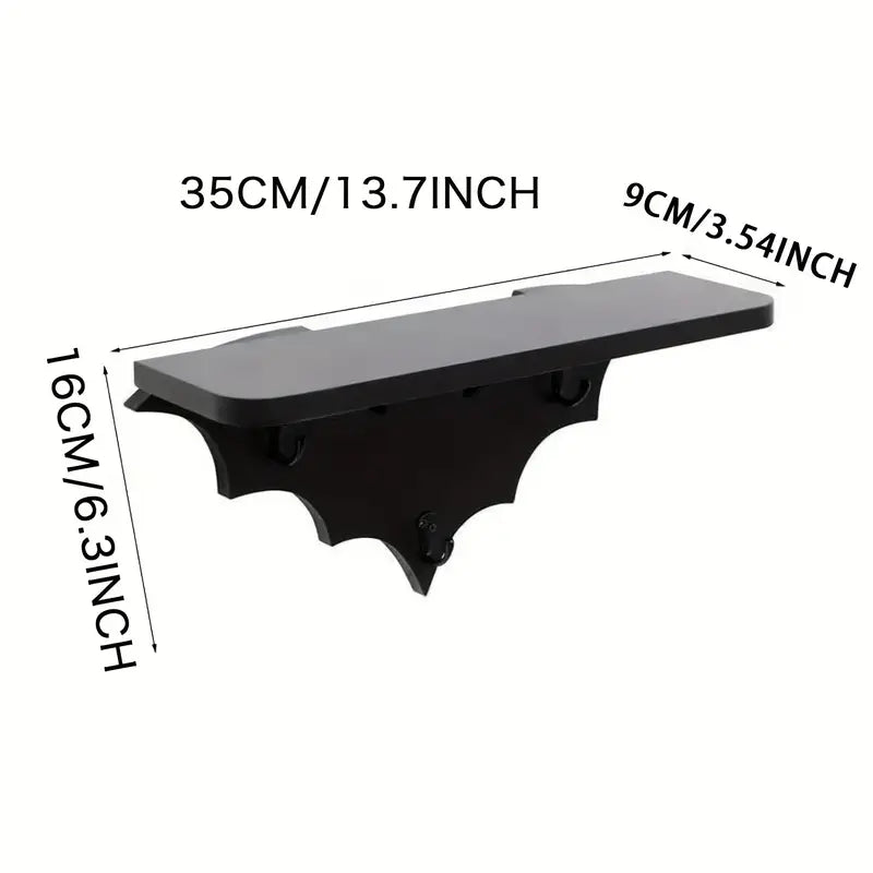 Black wooden bat shaped floating wall shelf featuring three metal key hooks for hanging gothic decor — view 2