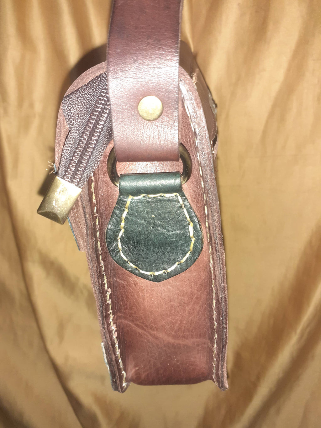 Two-tone leather crossbody bag with rustic finish, front zipper pocket, and long adjustable shoulder strap — view 5
