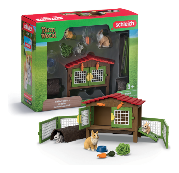Schleich rabbit hutch playset with a mother rabbit, two baby bunnies, hollow log, and slide