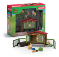 Schleich rabbit hutch playset with a mother rabbit, two baby bunnies, hollow log, and slide