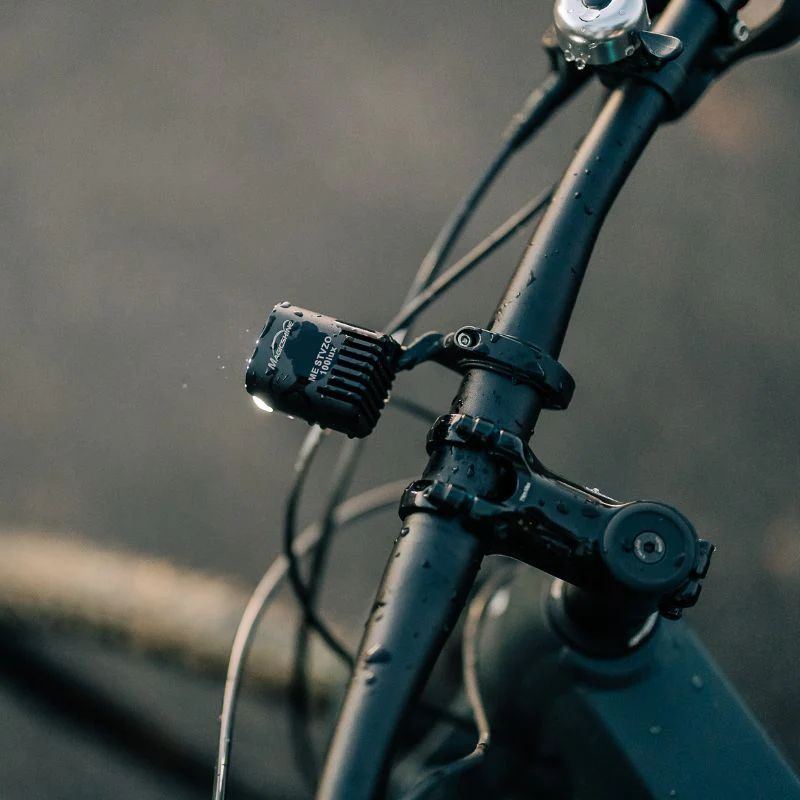 Black aluminum Magicshine ME 100LUX e-bike headlight with adjustable handlebar mounting bracket — view 2