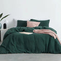 Pure cotton duvet cover set in berry purple showing luxurious stonewashed texture and matching pillow shams
