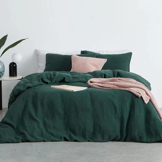 Pure cotton duvet cover set in berry purple showing luxurious stonewashed texture and matching pillow shams