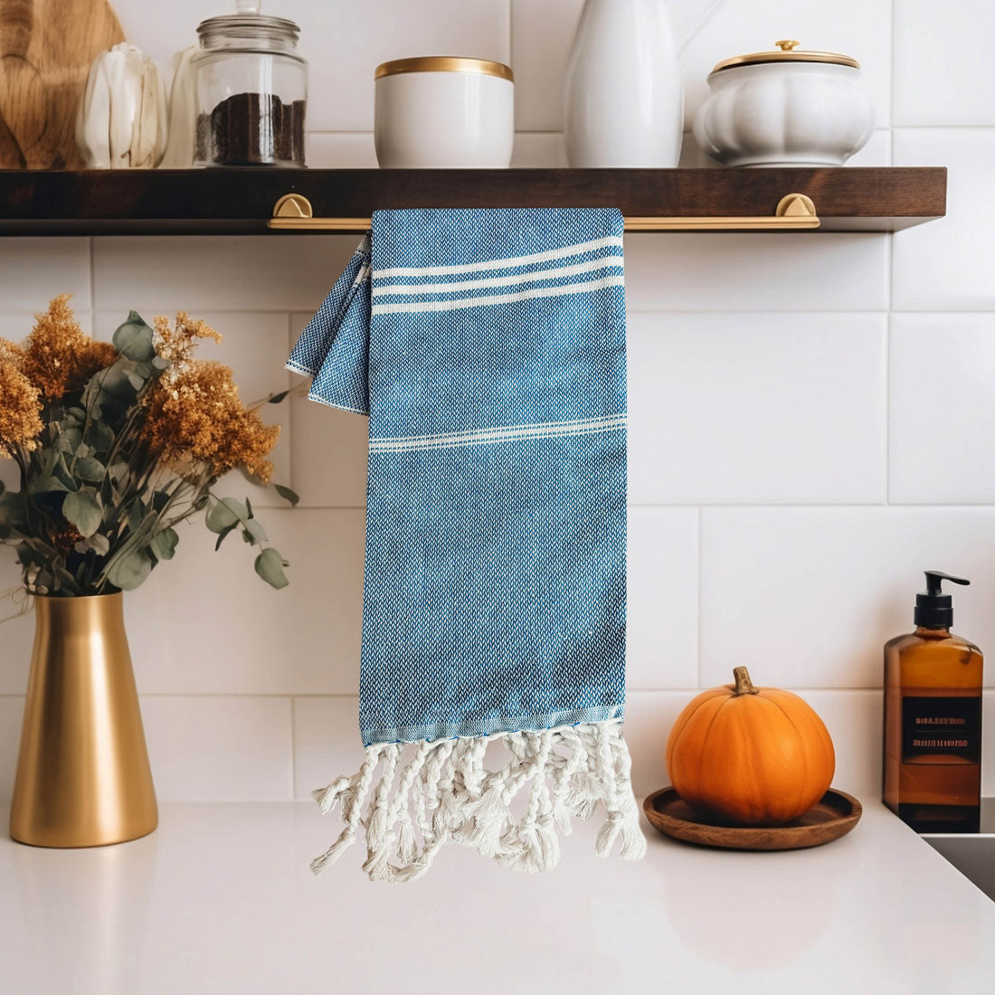 Oversized Turkish hand towel in premium cotton with natural bamboo tassels folded on a flat surface — view 5