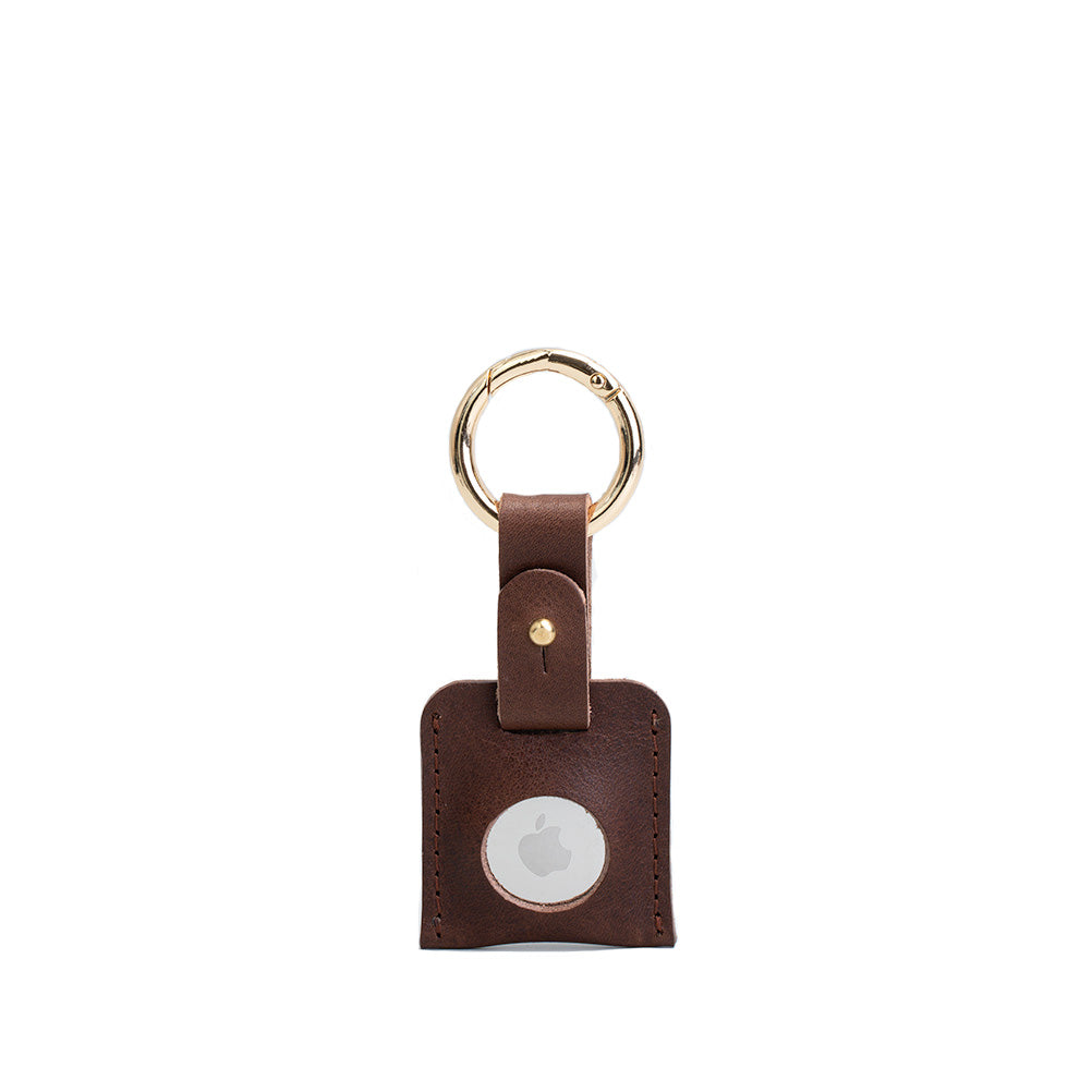 Leather AirTag keychain in premium full-grain leather with a sturdy metal circle carabiner