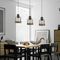 Vintage industrial brushed copper pendant light with a retro birdcage silhouette and hanging cable.