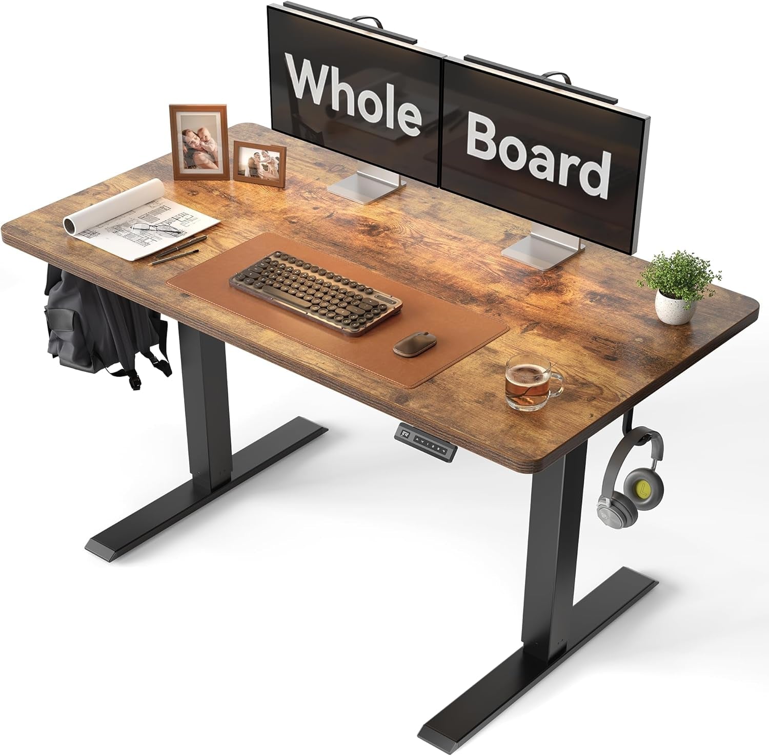 Large 48x24 electric standing desk in rustic brown with solid one-piece desktop and steel frame