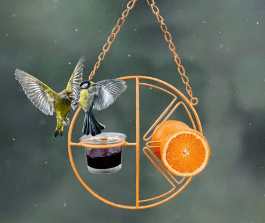 Deluxe metal swing bird feeder in vibrant iron hanging from a backyard garden branch. — view 2