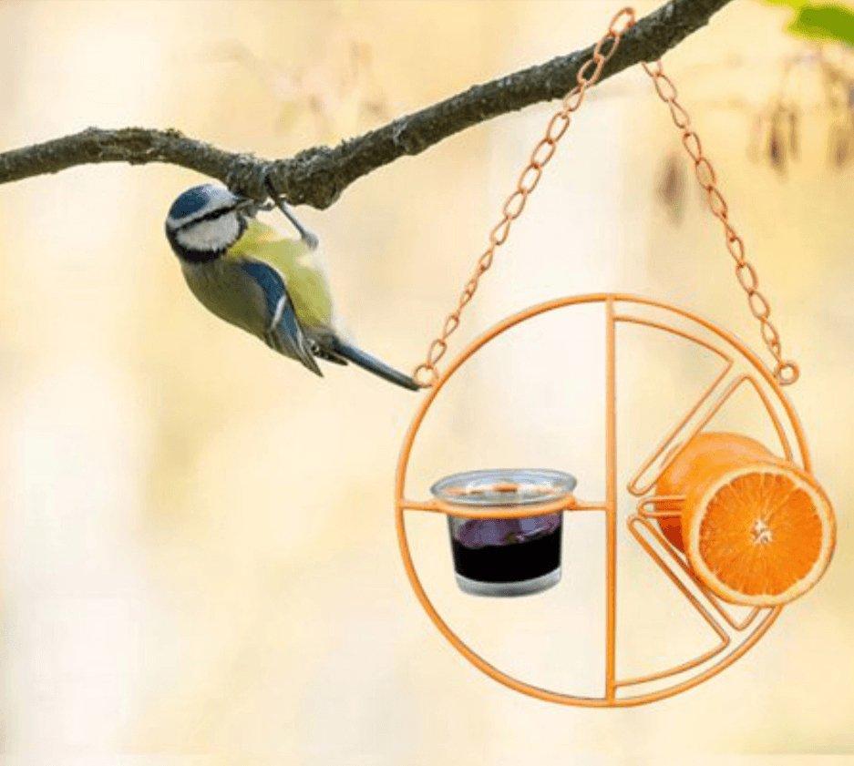 Deluxe metal swing bird feeder in vibrant iron hanging from a backyard garden branch. — view 4