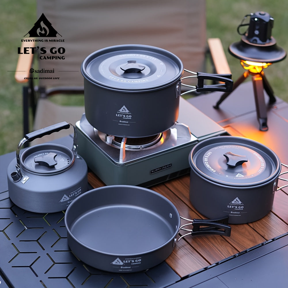 Black 4-piece aluminum camping cookware set including a cooking pot, frying pan, and portable kettle — view 2