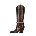 Diamond encrusted leather knee-high boots in glossy brown croc-embossed texture with pointed toe
