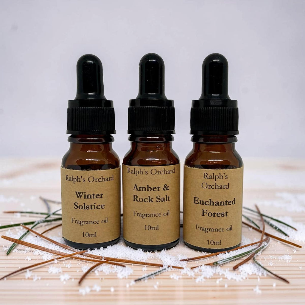 Fragrance oil gift set featuring three 10ml amber glass pipette bottles in a curated arrangement — view 3