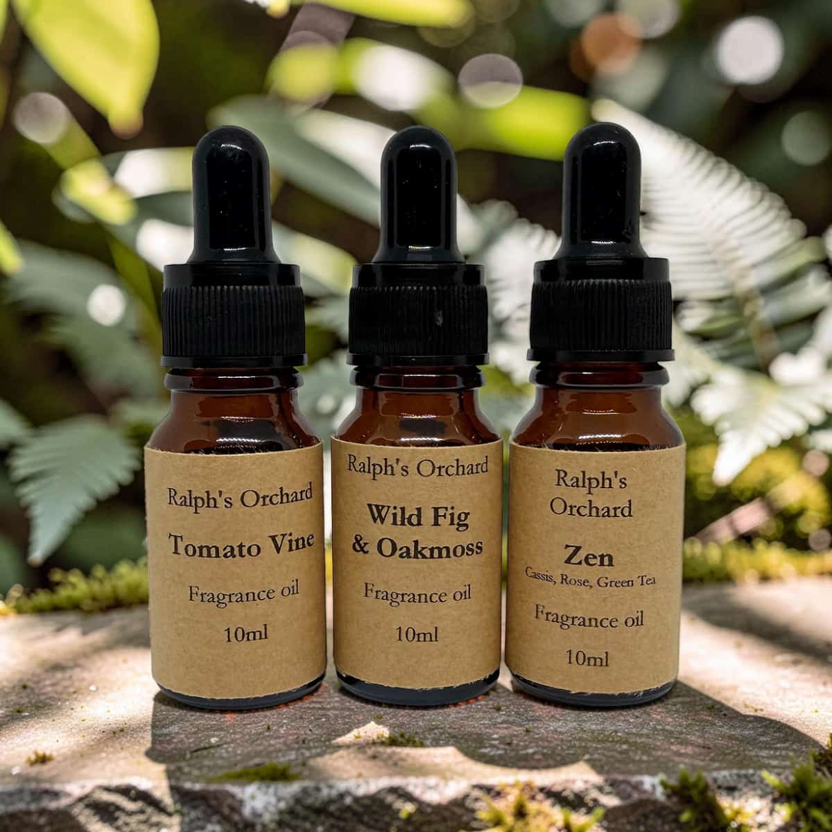 Fragrance oil gift set featuring three 10ml amber glass pipette bottles in a curated arrangement — view 2