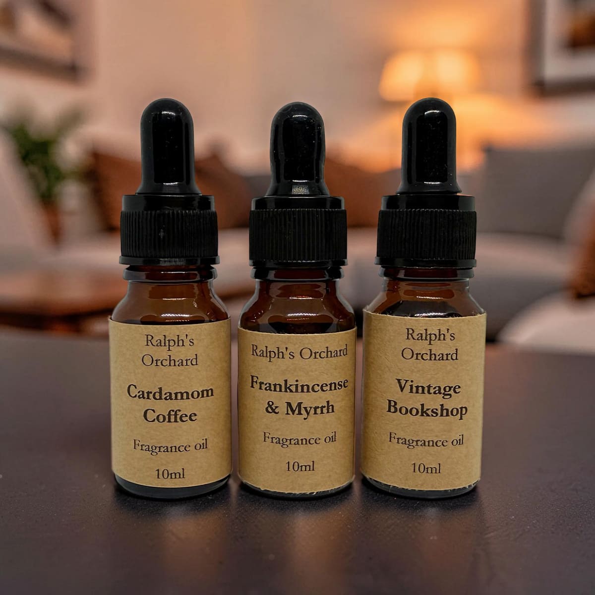 Fragrance oil gift set featuring three 10ml amber glass pipette bottles in a curated arrangement — view 4