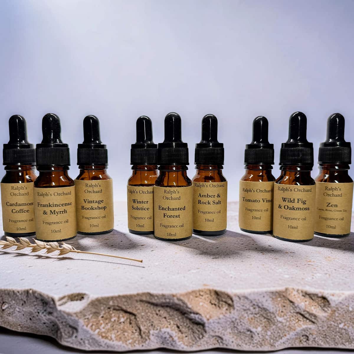 Fragrance oil gift set featuring three 10ml amber glass pipette bottles in a curated arrangement