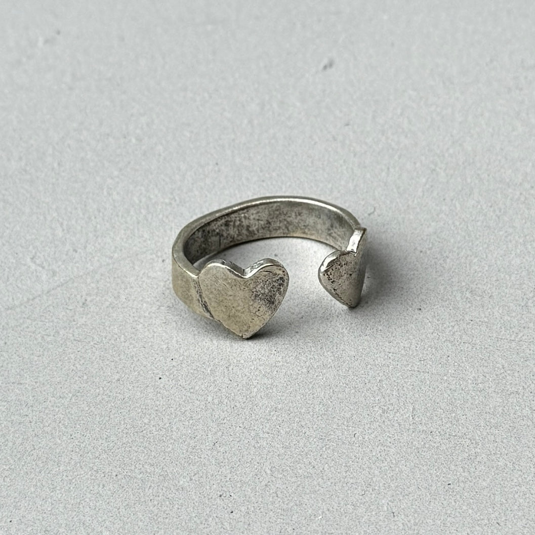 Crossed hearts silver ring with adjustable open back and distressed vintage style finish. — view 3