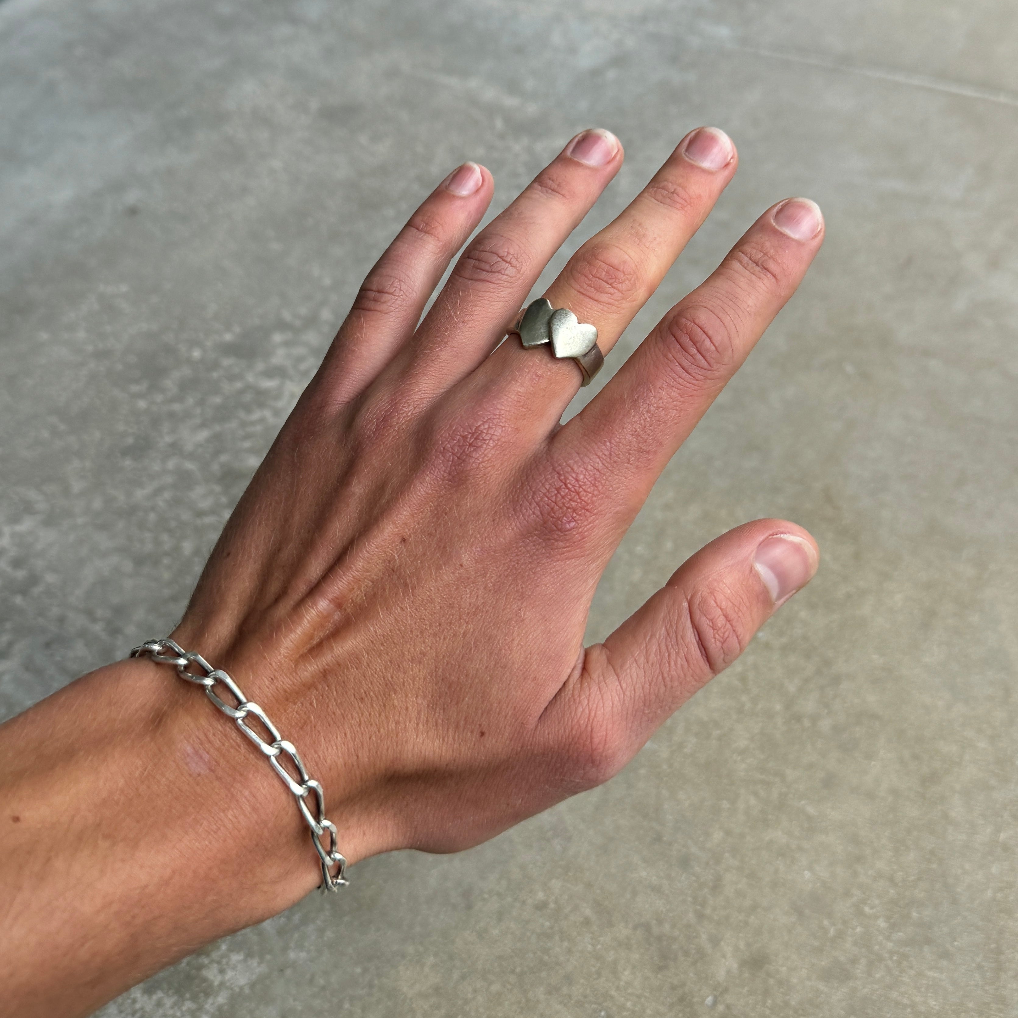 Crossed hearts silver ring with adjustable open back and distressed vintage style finish. — view 4