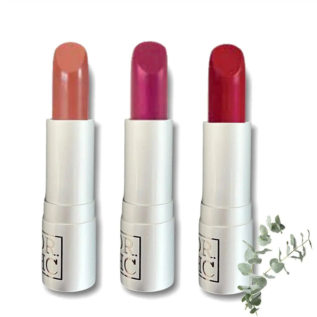 Natural organic vegan matte lipstick tube and rich color swatches on a clean background