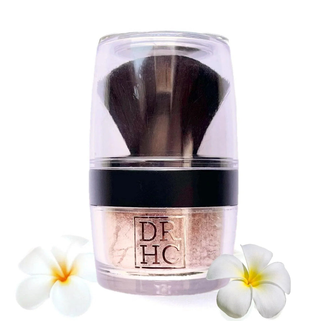 Silky Mineral CC Powder in a travel compact with built-in mirror and buffing makeup brush