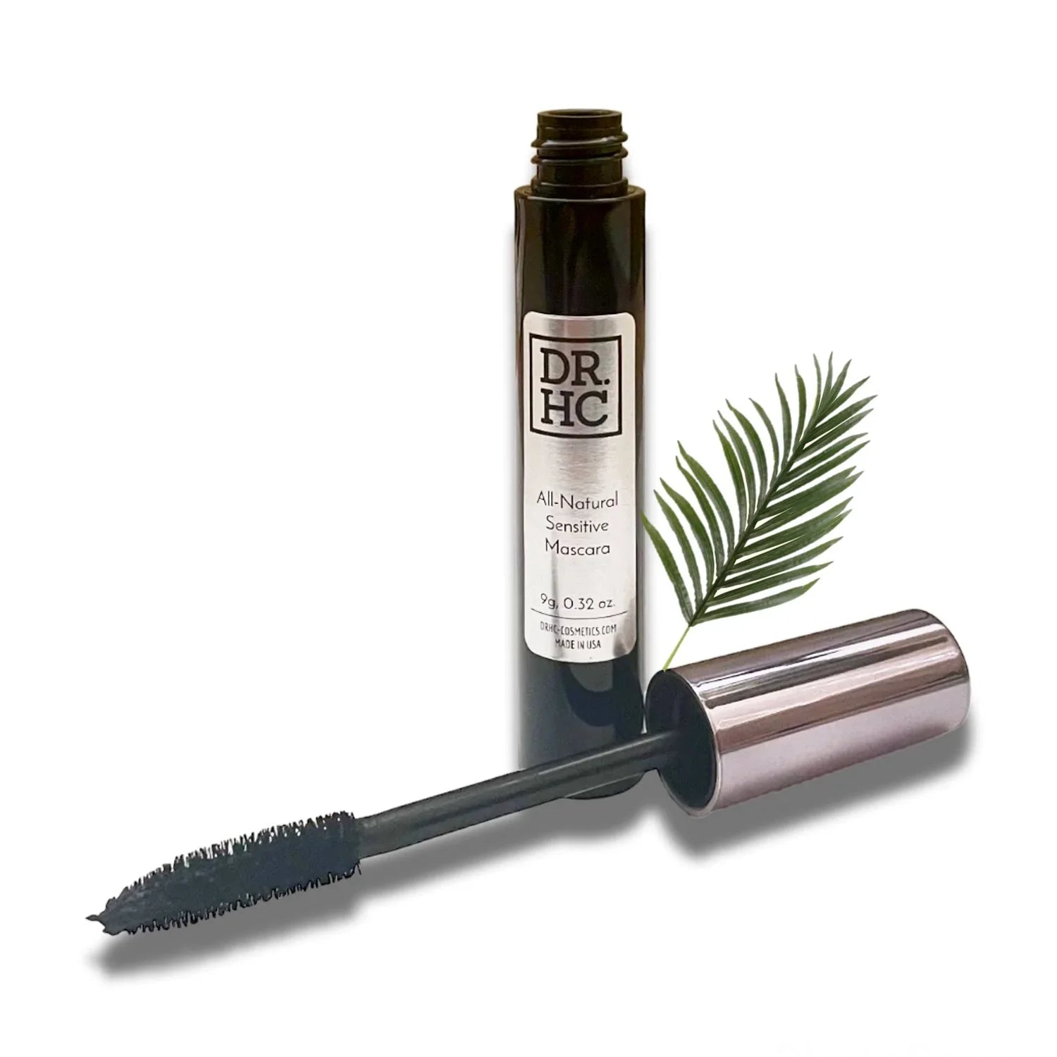 All-natural sensitive mascara tube and wand, formulated for voluminous lashes in black or dark brown.