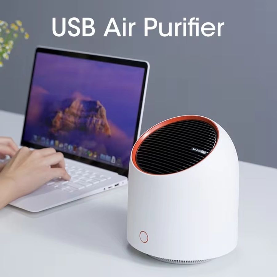Portable mini USB air purifier in compact design for home and office desk use