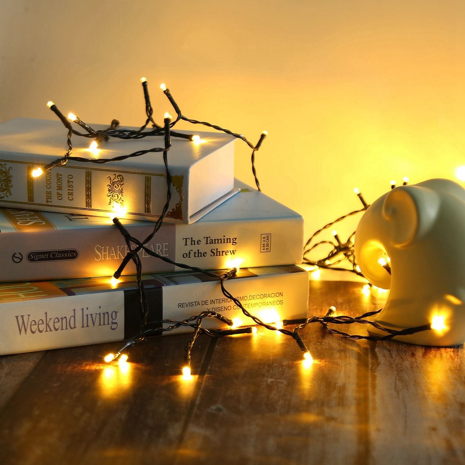 Multicolor solar string lights wrapped on copper wire with attached ground stake and solar panel — view 4